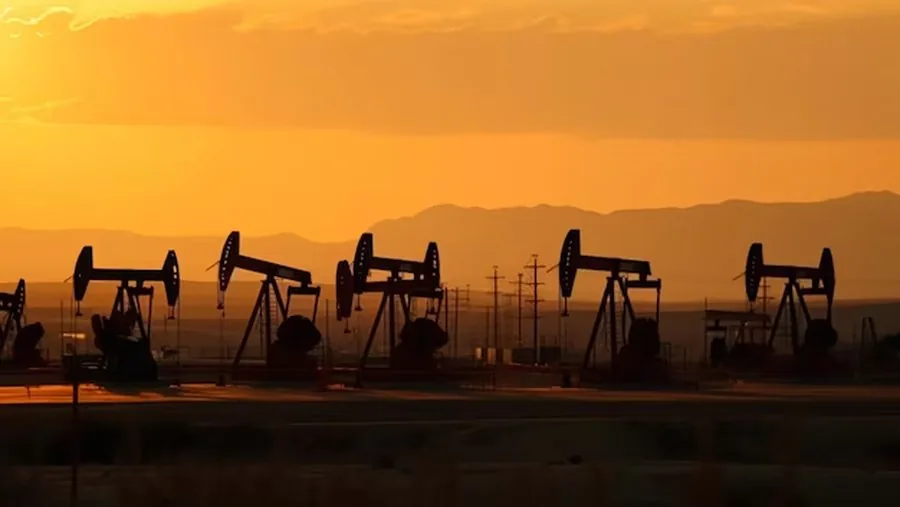Oil and gas field at sunset